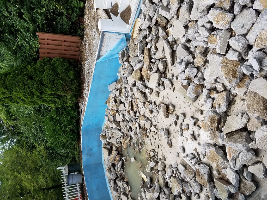 Pieces of concrete from tearing out a swimming pool